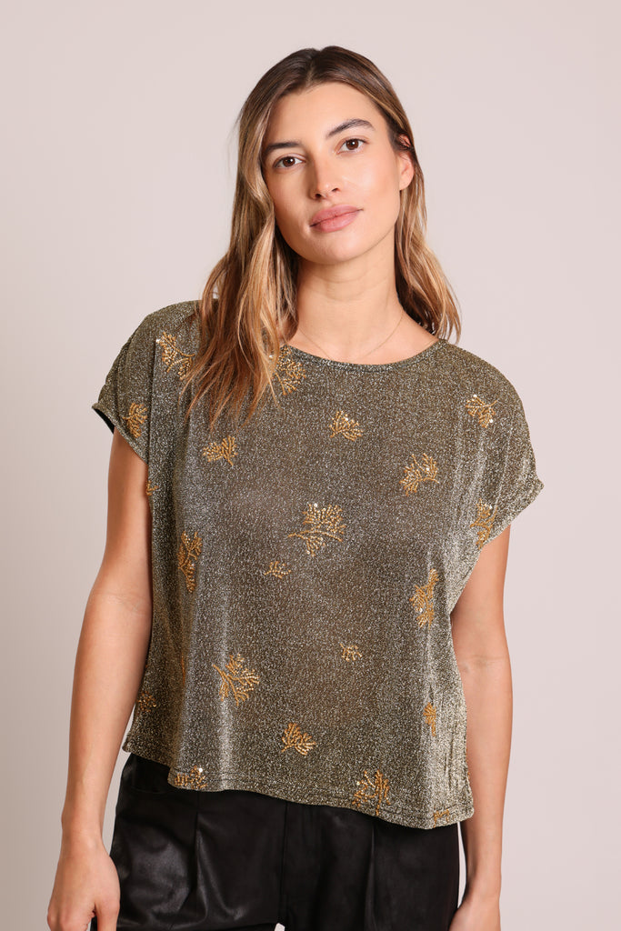 Close up front shot of model wearing a black and silver glitter gold beaded short sleeve slouch shirt.