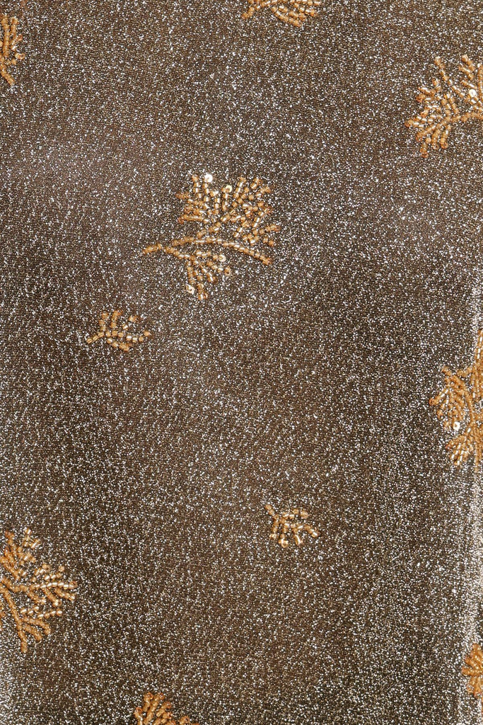 Swatch for black and silver glittery beaded top fabric.