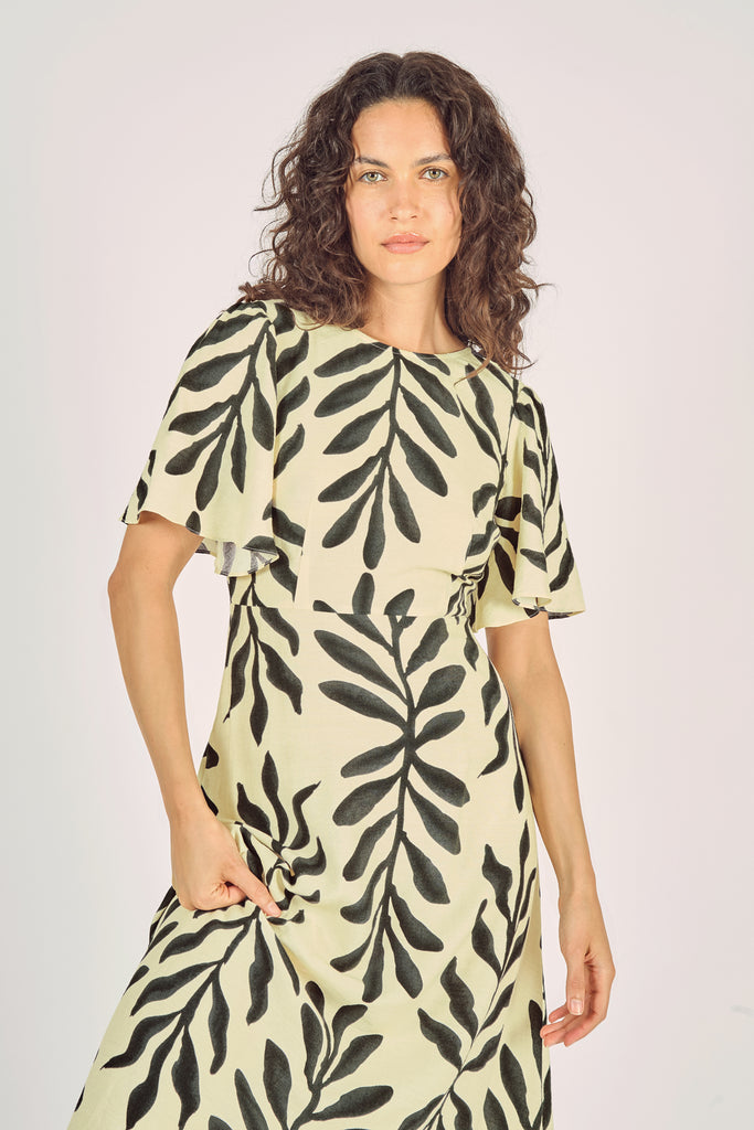 Another Close Up Front Model Shot of Cream and Black Leaf Print Trumpet Sleeve Fit and Flare Maxi Dress.