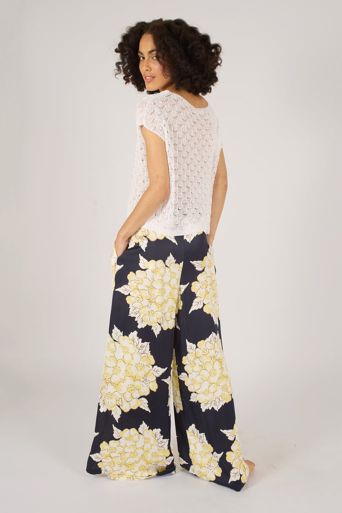 Back Model Shot of Navy Blue and Cream Floral Wide Leg Women's Trousers.