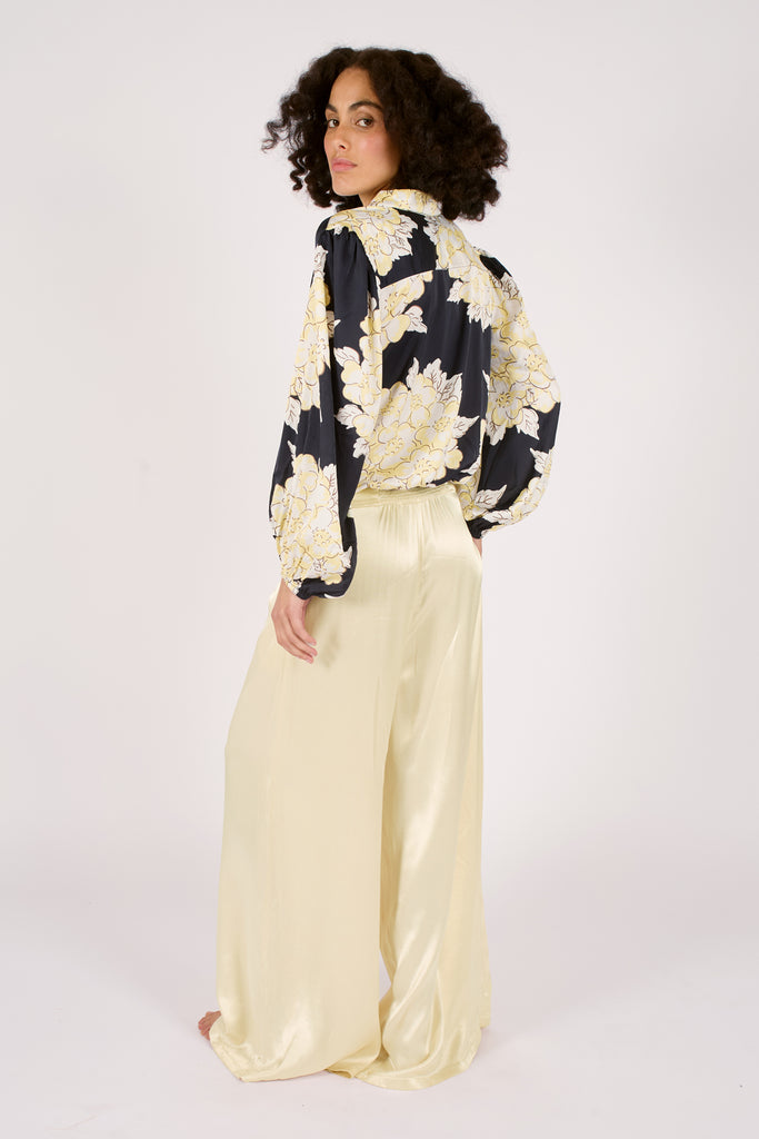 Back Model Shot of Navy Blue and Cream Floral Long Sleeve Tie Front Button Up Women's Blouse.