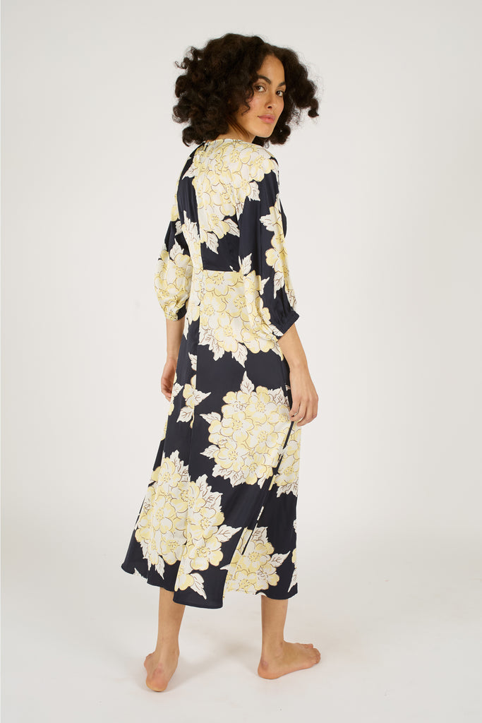 Back Model Shot of Navy Blue and Cream Floral V-Neck Three Quarter Sleeve Midi Dress.