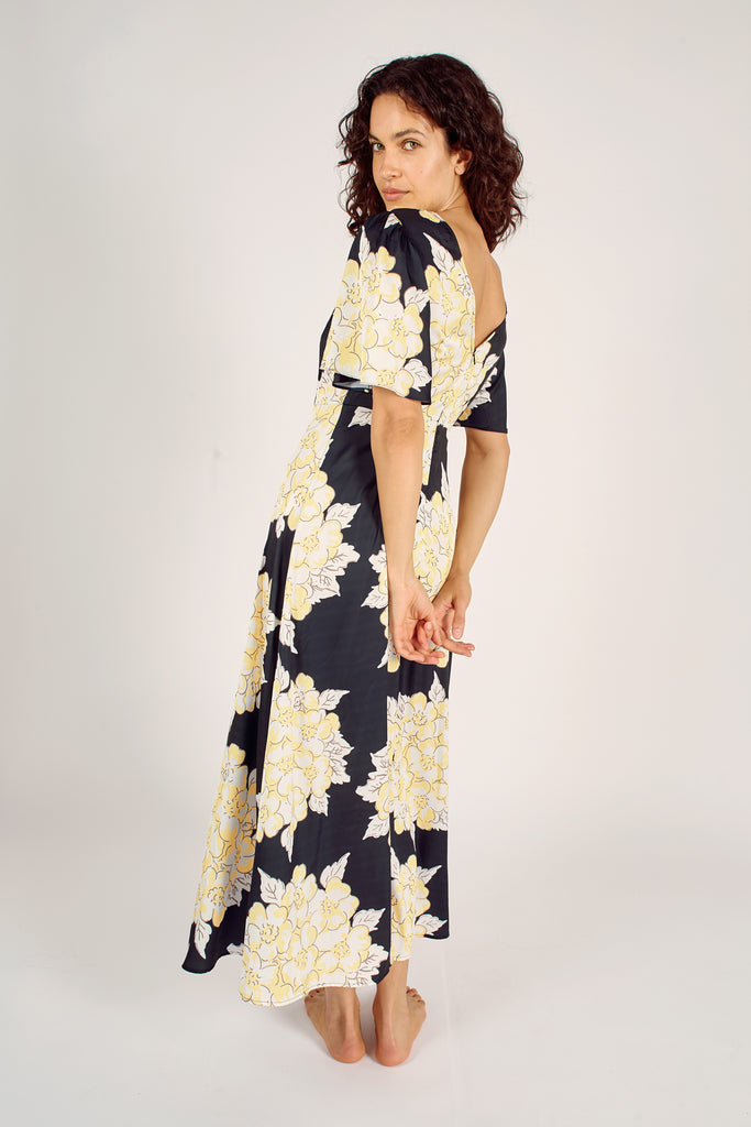 Back Model Shot of Navy Blue and Cream Floral Trumpet Sleeve Fit and Flare Maxi Dress.