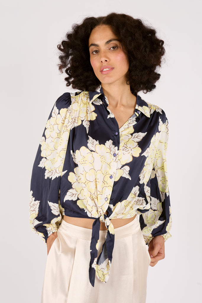 Close Up Front Model Shot of Navy Blue and Cream Floral Long Sleeve Tie Front Button Up Women's Blouse.