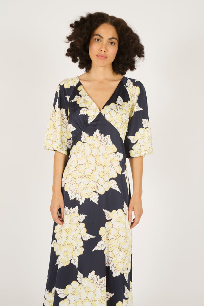 Close Up Front Model Shot of Navy Blue and Cream Floral V-Neck Three Quarter Sleeve Midi Dress.