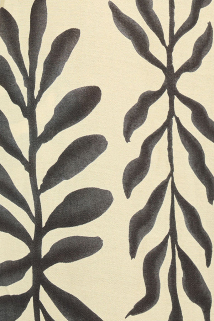 Close Up of Cream and Black Leaf Print Maxi Dress Fabric.