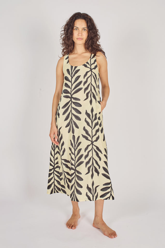 Front Model Shot of Cream and Black Leaf Print Sleeveless Midi Dress with Pockets.