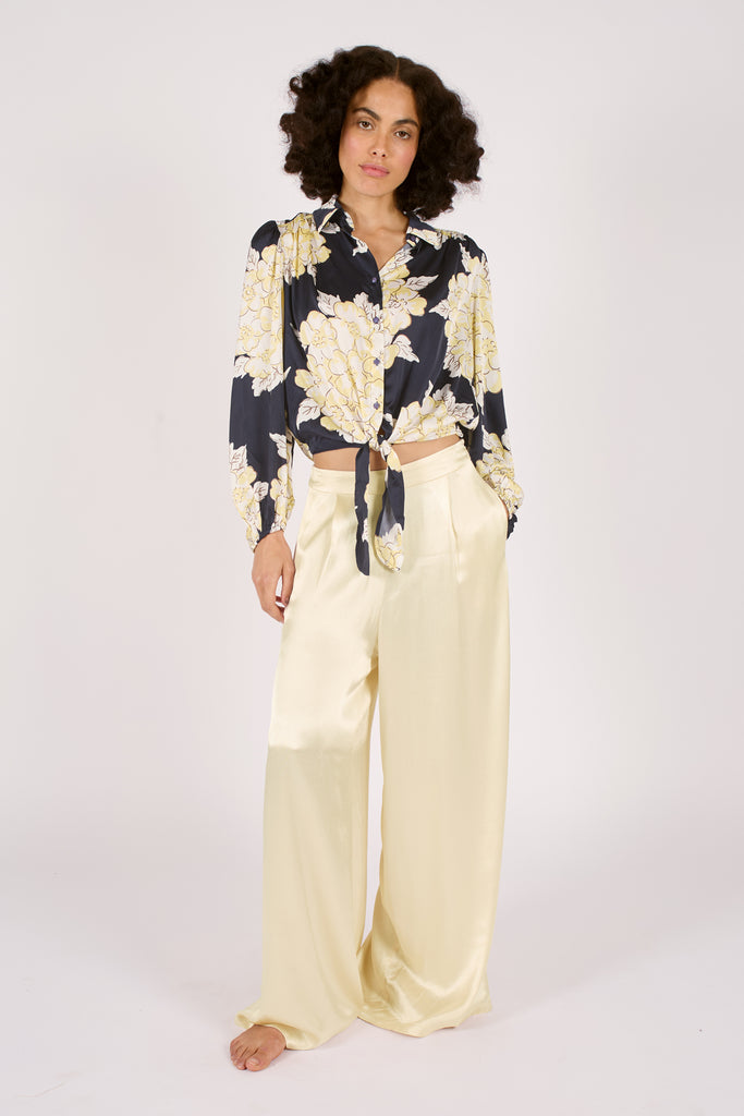Front Model Shot of Navy Blue and Cream Floral Long Sleeve Tie Front Button Up Women's Blouse.
