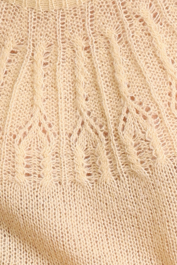 Swatch for cream knitted jumper fabric.