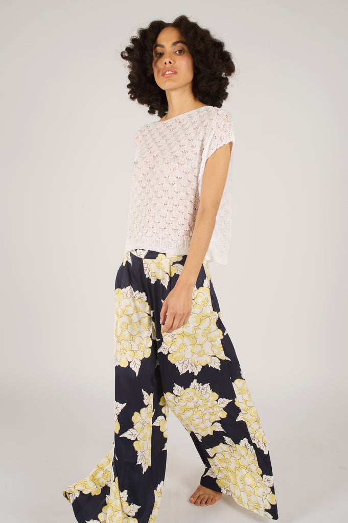 Side Model Shot of Navy Blue and Cream Floral Wide Leg Women's Trousers.