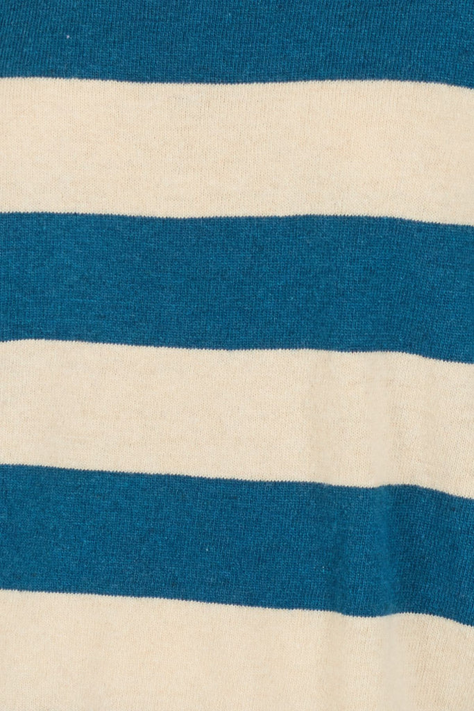 Close Up of Blue and Cream Striped Knitted Women's Jumper Fabric