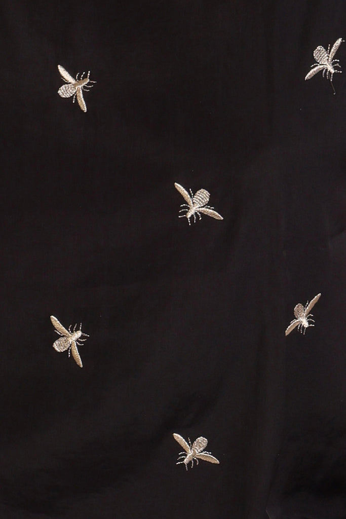 Swatch for black metallic embroidered blouse fabric.